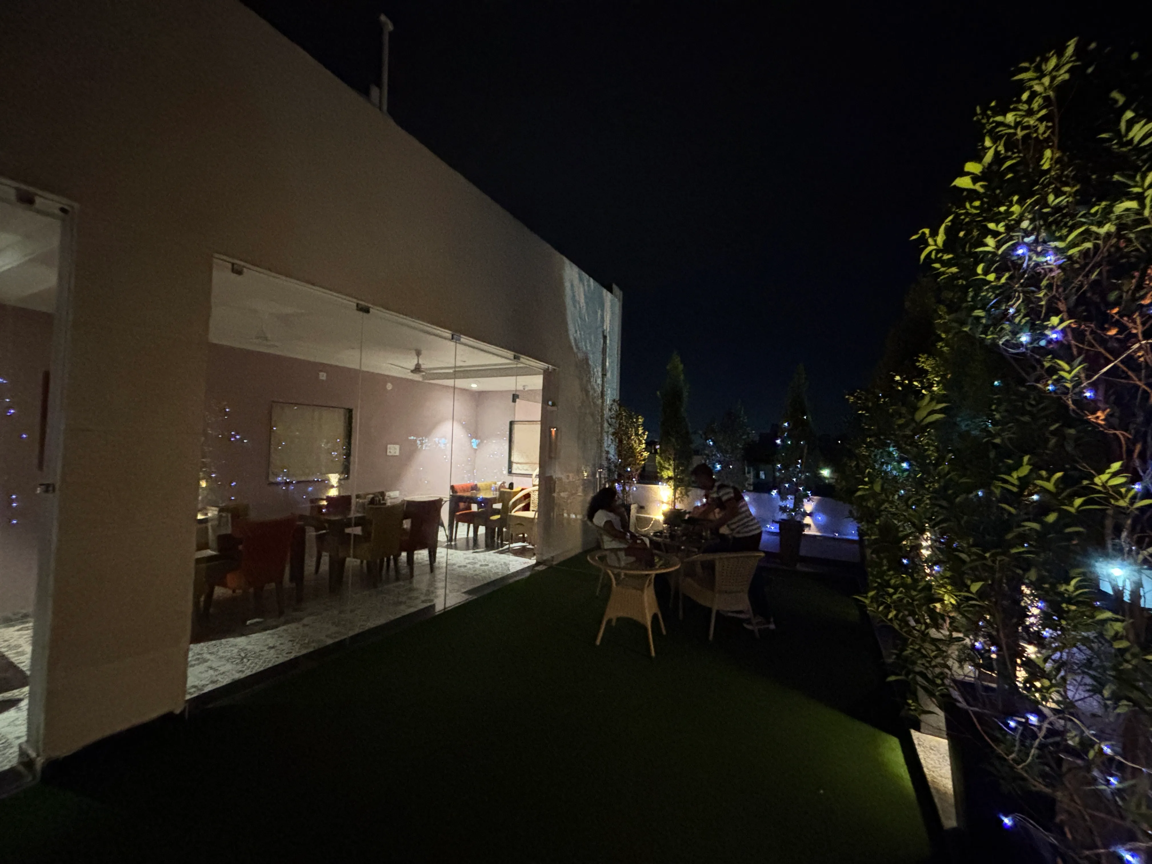 Evening rooftop dining area at ARK Kitchen Ranchi